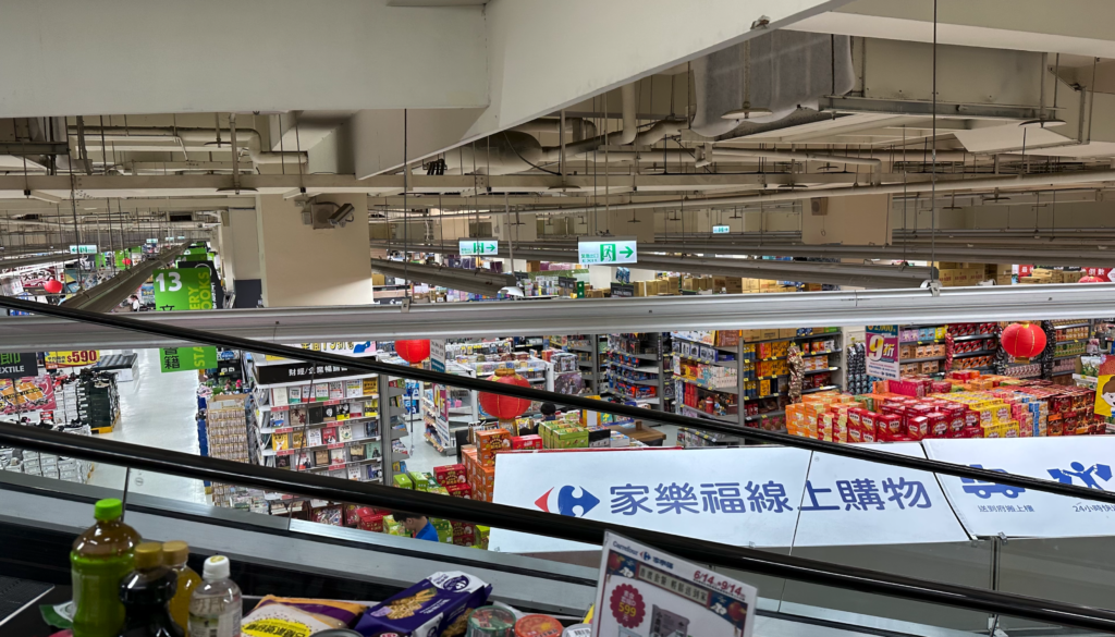 a store with escalators and shelves