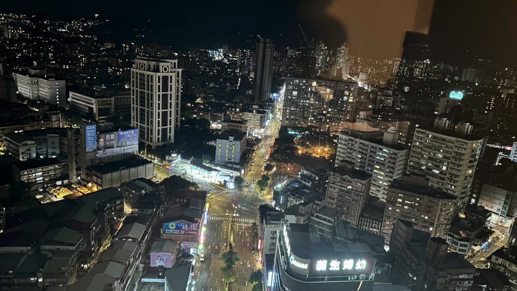 a city at night with buildings and lights