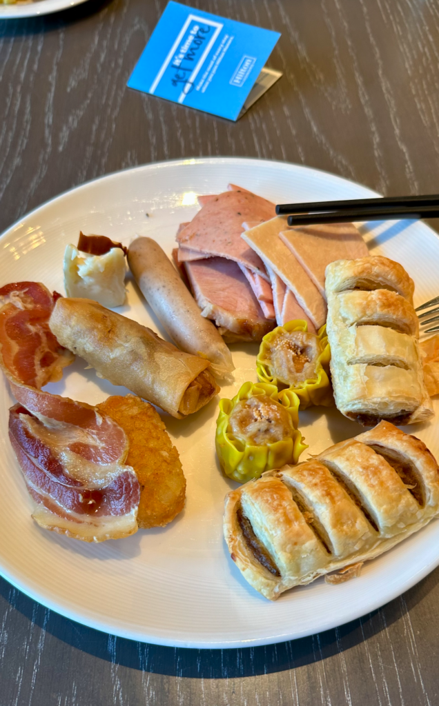 a plate of food with chopsticks