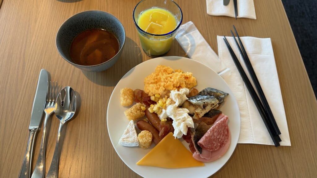 a plate of food and a drink on a table